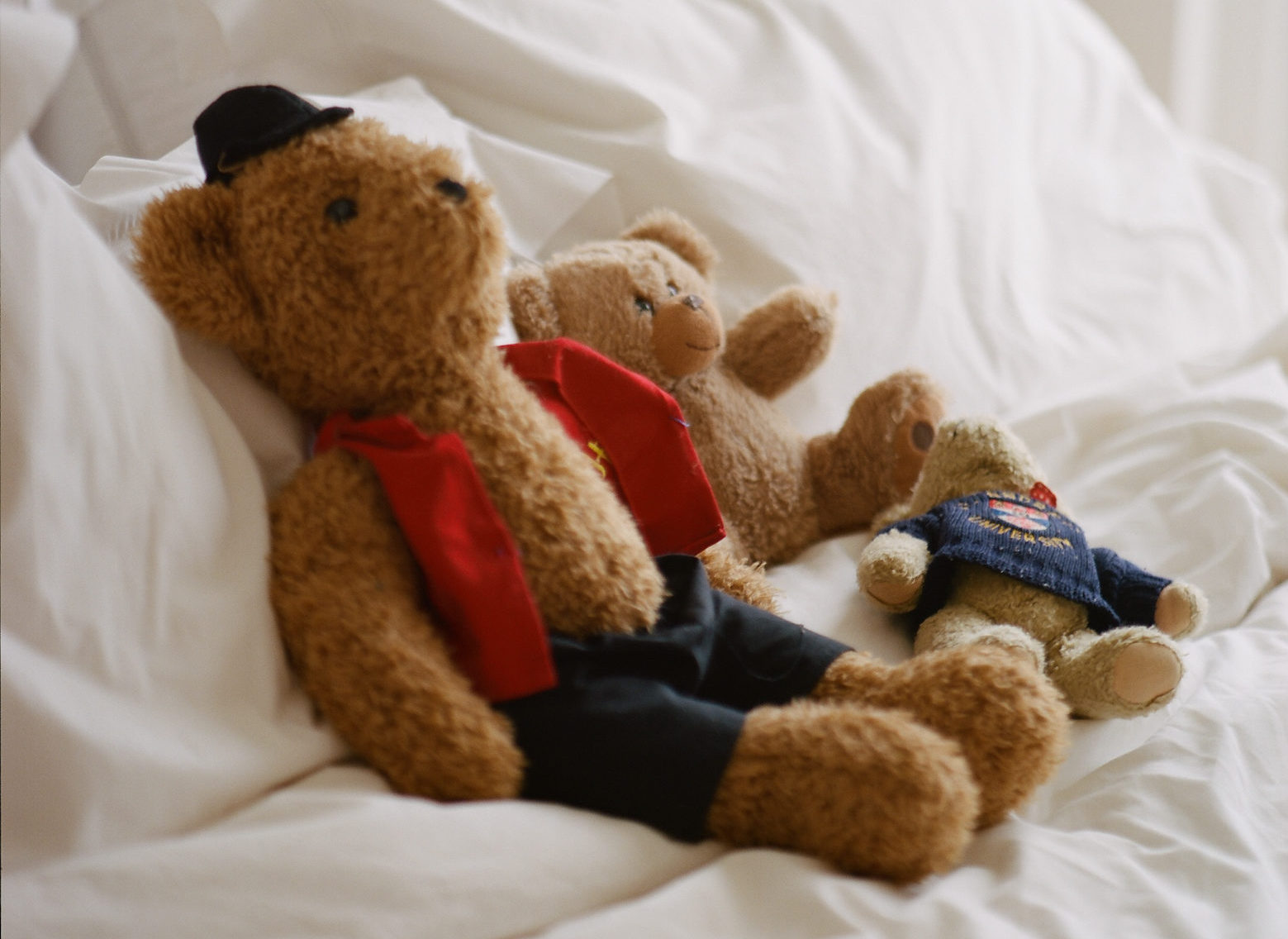 toddler's toys lying on a bed | Batelle